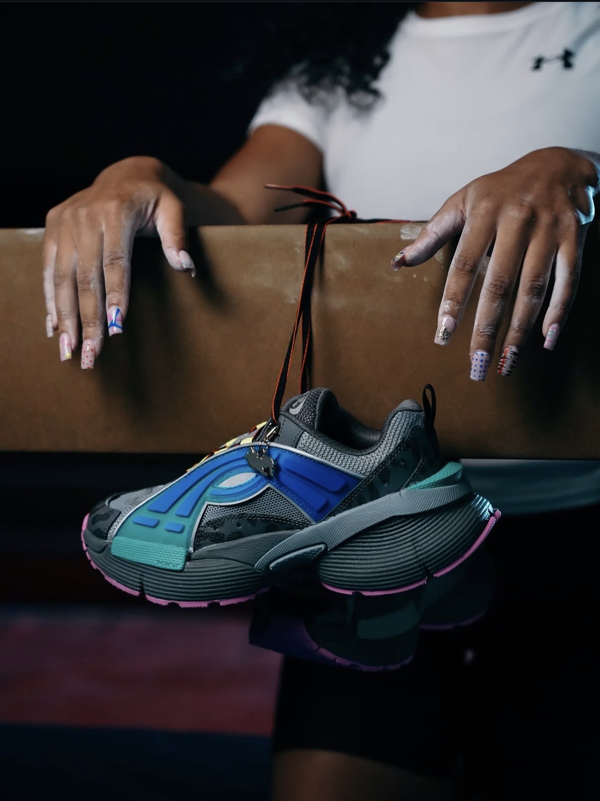 Sneaker product shot hanging from a balance beam