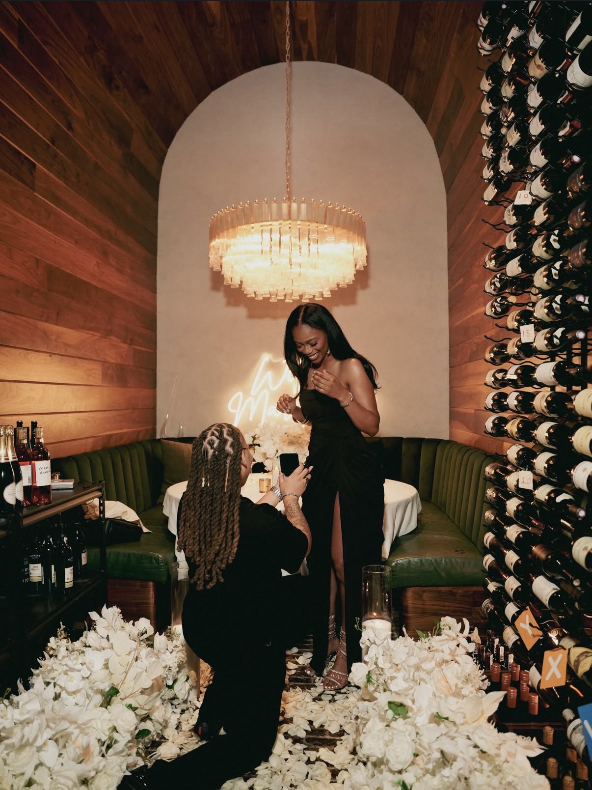 Surprise proposal in a candlelit wine room