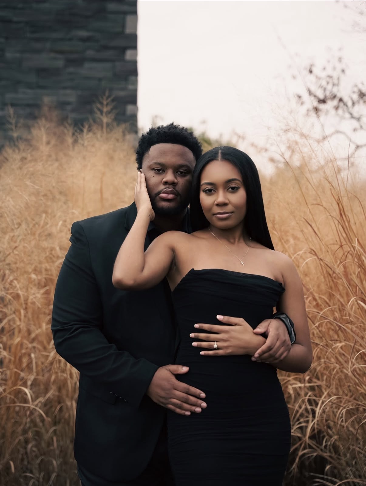 Engagement portrait in tall autumn grass