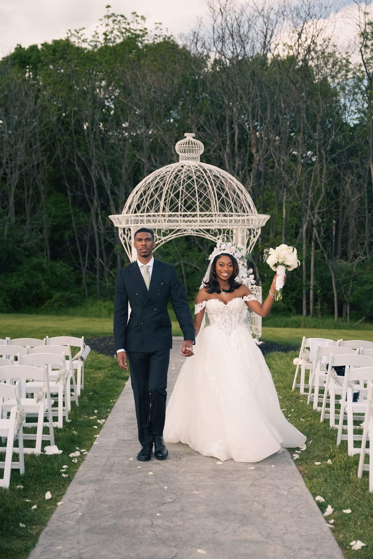 Bride and groom walk the aisle after the ceremony