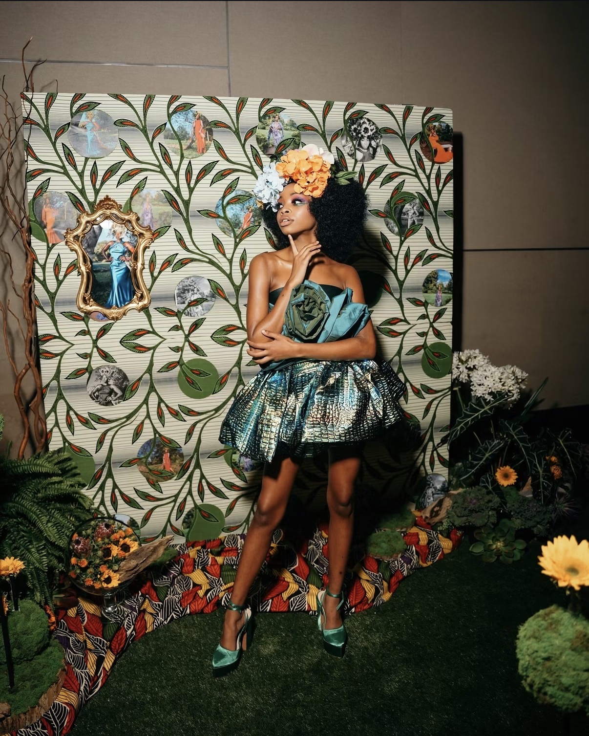 Guest posing at a styled floral event backdrop