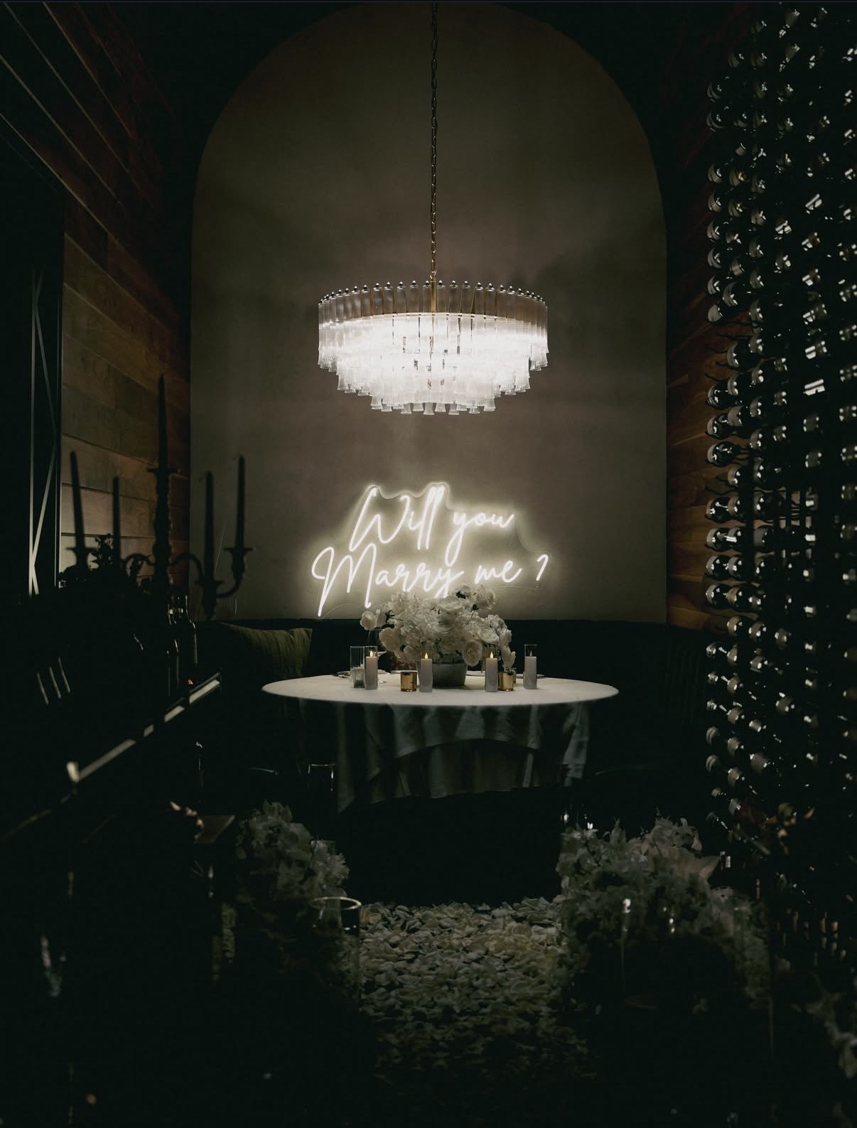Proposal setup with chandelier and neon sign
